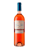 Glas Roséwein Gran Rosé 2021 Merlot DOC Ticino von Vini Gialdi Brivio, hellrosa Farbe, in Weinglas auf Tisch.