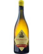 Château-Fuissé Pouilly Fuissé 1er Cru 2023 Weißwein in einem Glas, hellgelbe Farbe, elegante Flasche im Hintergrund