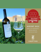 Gorghi Tondi Grillo KHEIRÈ Riserva 2022 DOC Sicilia white wine bottle with elegant label in a vineyard setting.